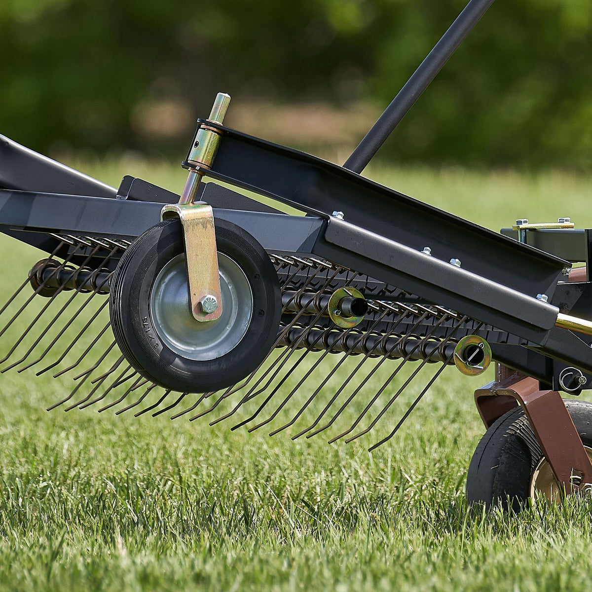 Grasshopper Dethatcher (533460) — manufacturer marketing image (grasshoppermower.com/attachments/frontmount-dethatcher)